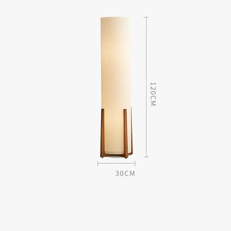 small Wabi-sabi floor lamp with wooden base and cylindrical fabric shade, placed in a minimalist interior with natural tones