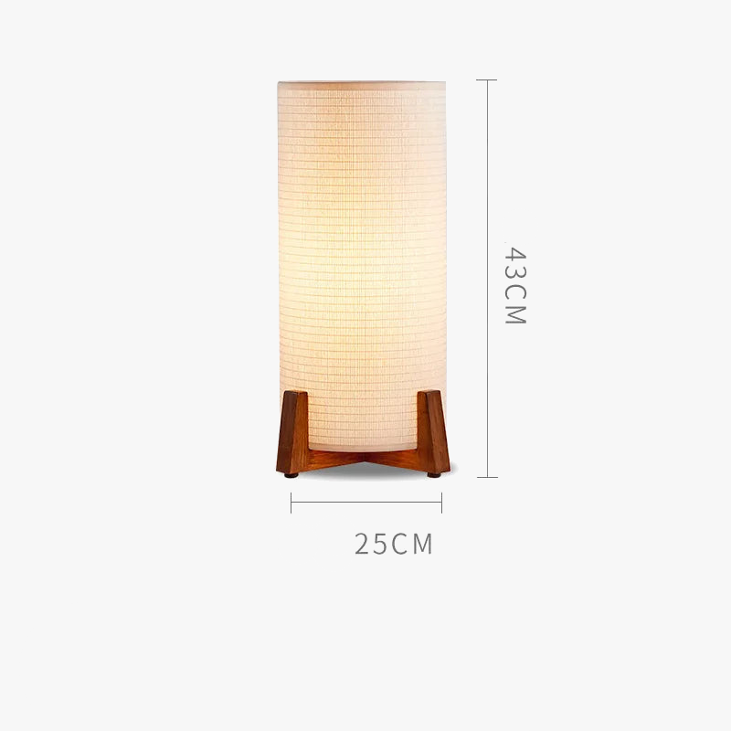 small Wabi-sabi floor lamp with wooden base and cylindrical fabric shade, placed in a minimalist interior with natural tones