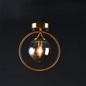 Plafonnier anneau doré boule verre chic | GIZOR