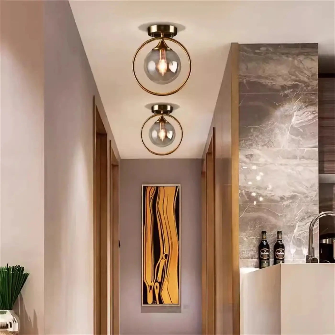 Plafonnier anneau doré boule verre chic | GIZOR